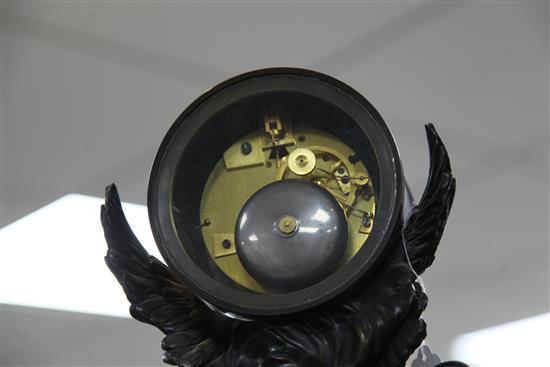 A 19th century French Empire style bronze and marble mantel clock, 17.75in.